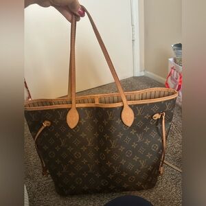 Genuine Louis Vuitton Never full bag MM in monogram print.